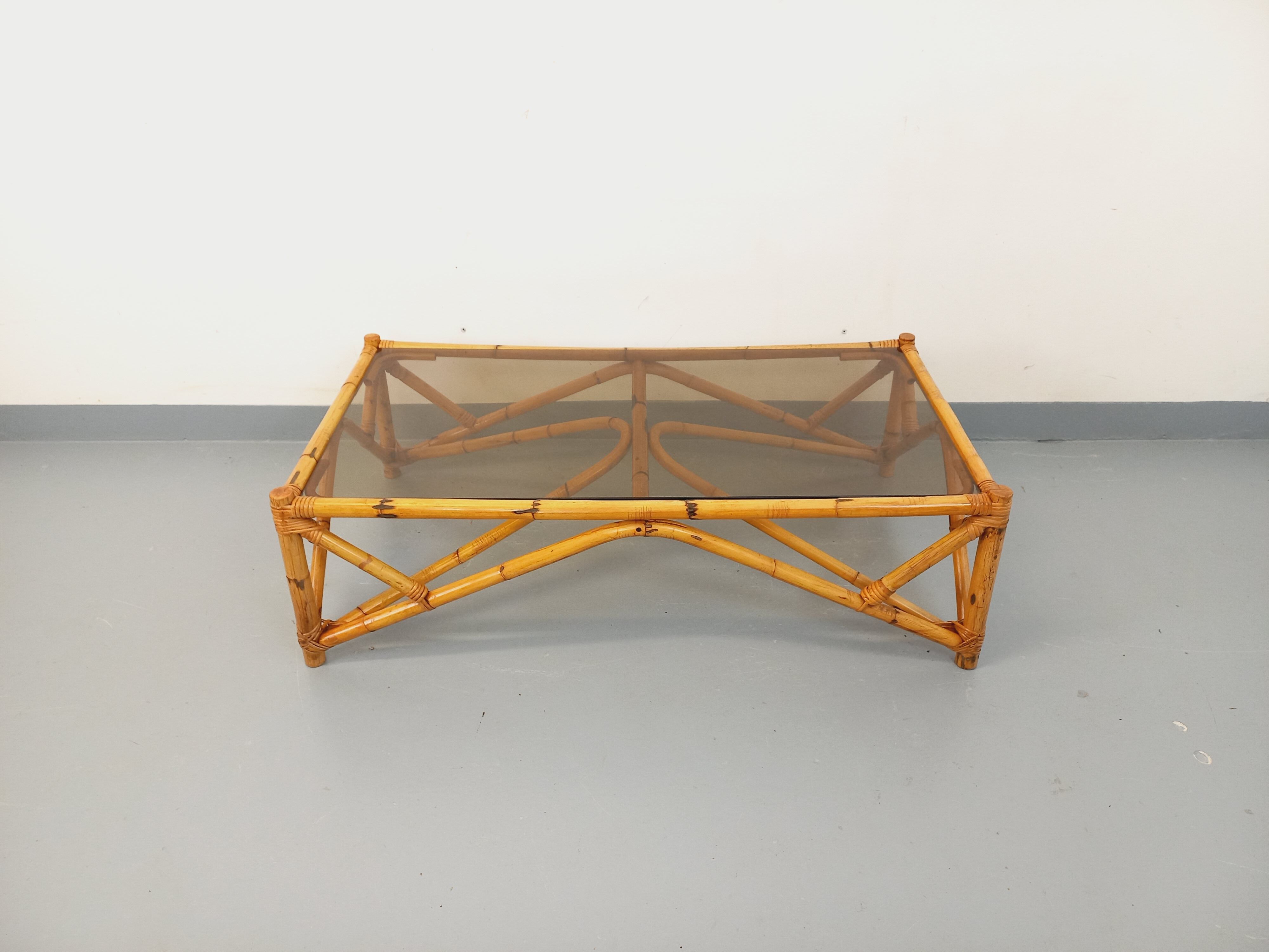 Vintage rectangular coffee table in rattan and smoked glass from the 1970s.