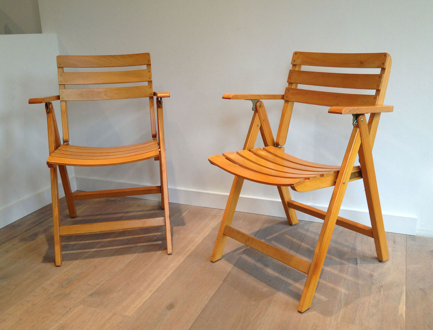 Pair of folding armchairs in varnished wood signed Clairitex