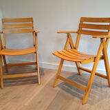 Pair of folding armchairs in varnished wood signed Clairitex