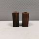 A set of salt and pepper shakers in rosewood