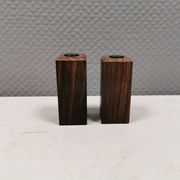 A set of salt and pepper shakers in rosewood