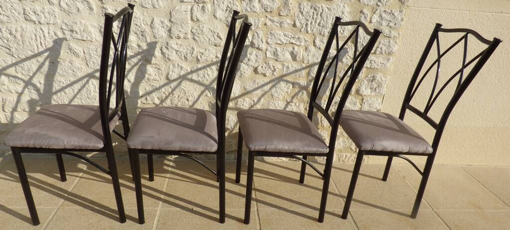 4 black metal chairs with high backs and gray suede tops