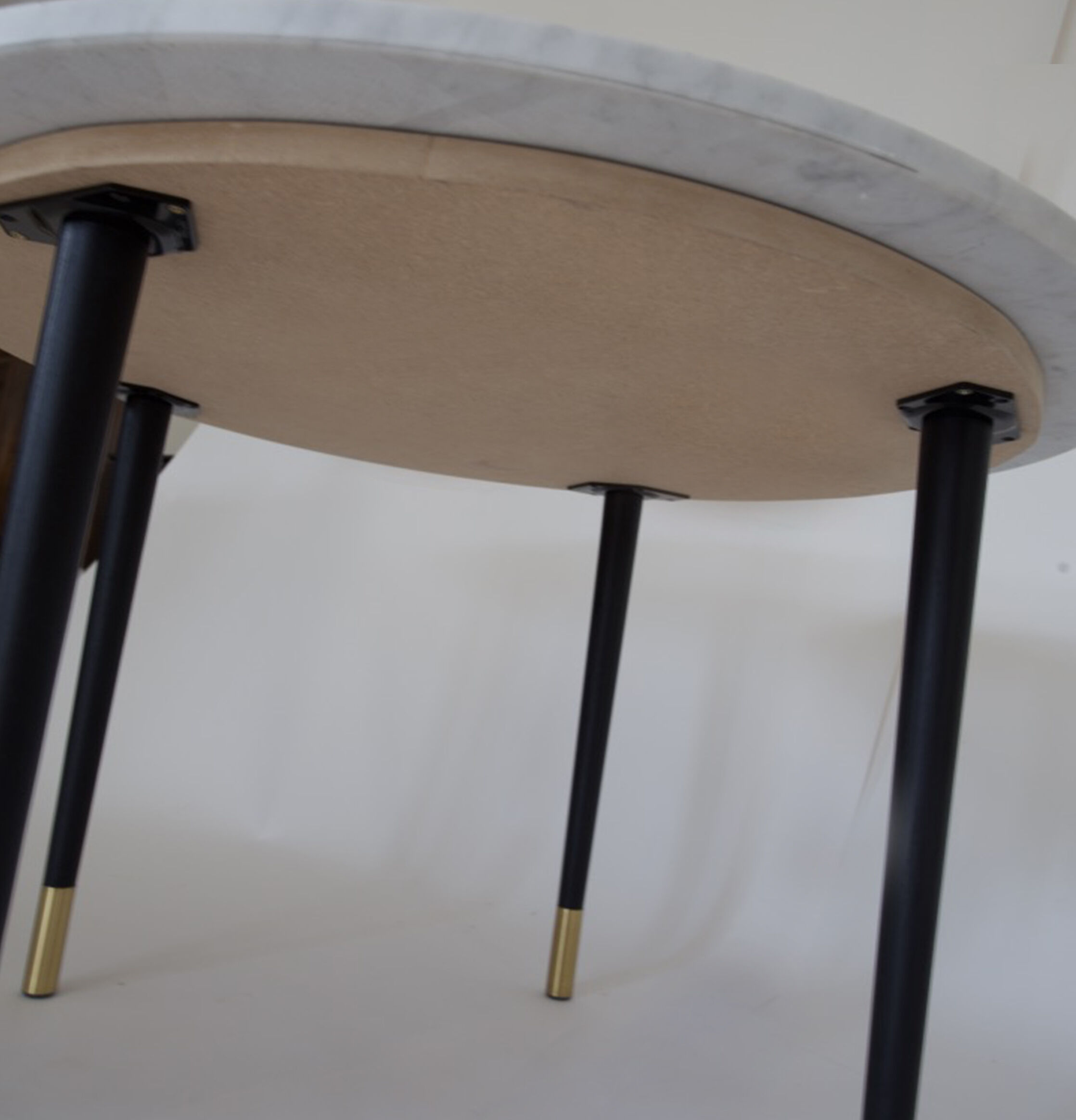 Coffee table in marble, wood and brass