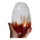 Vintage blown glass vase with a speckled red design