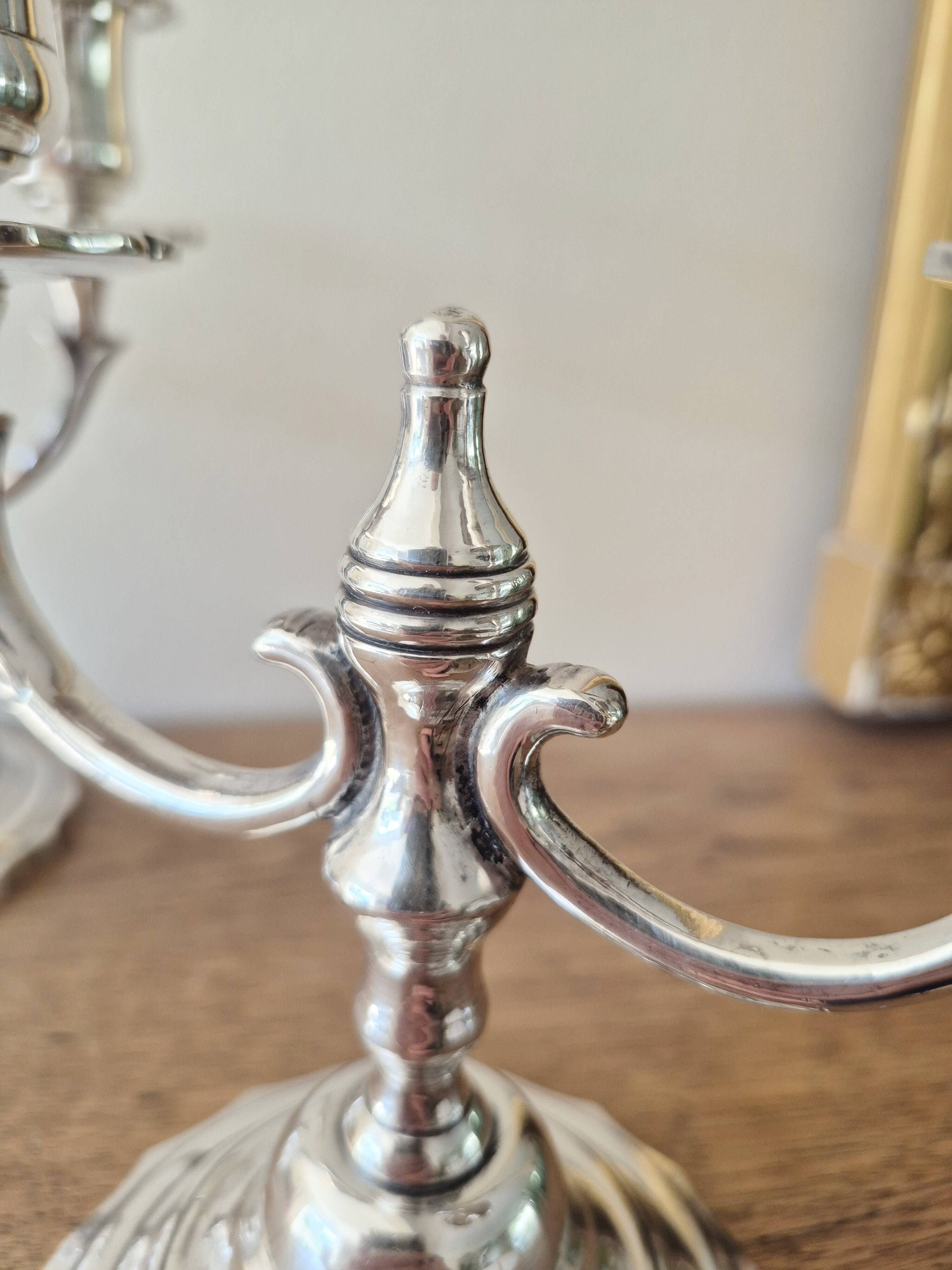 Pair of silver-plated metal candlesticks with 2 branches.