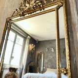 Antique gilded mirror with parcloses from the 19th century.