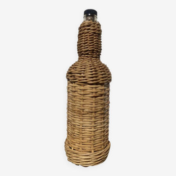 Old woven wicker bottle