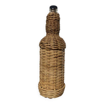 Old woven wicker bottle