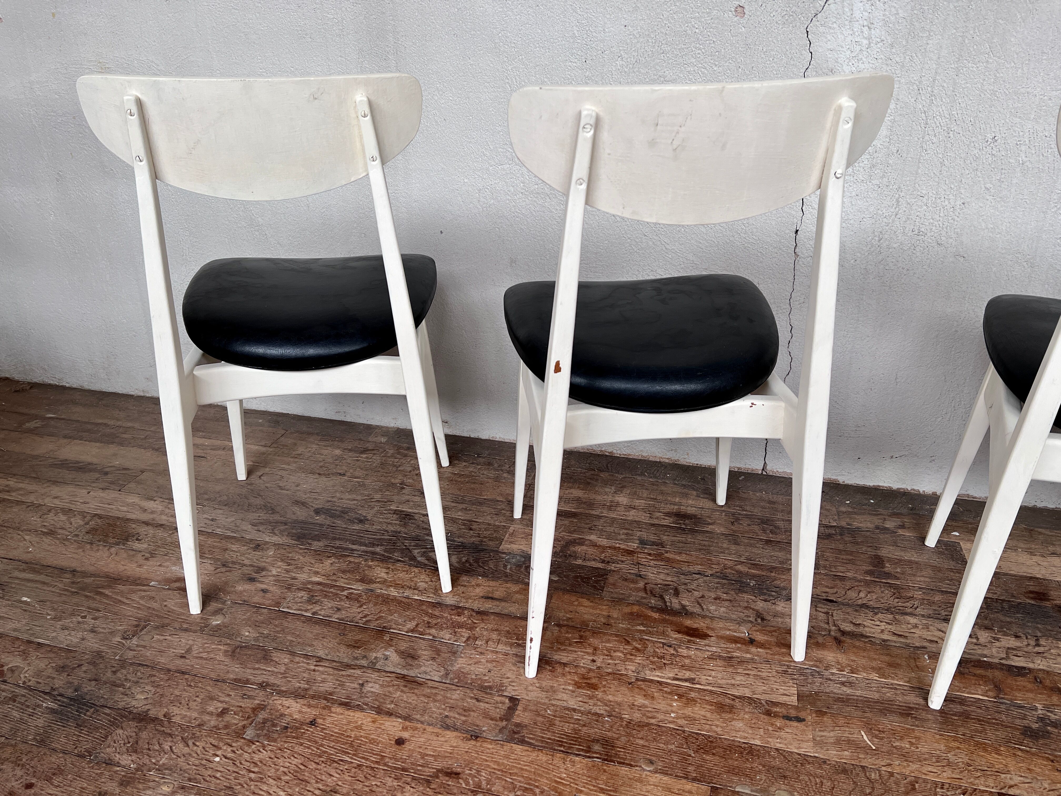 Series of 4 white and black Scandinavian chairs Ingrid from Stella 1960.