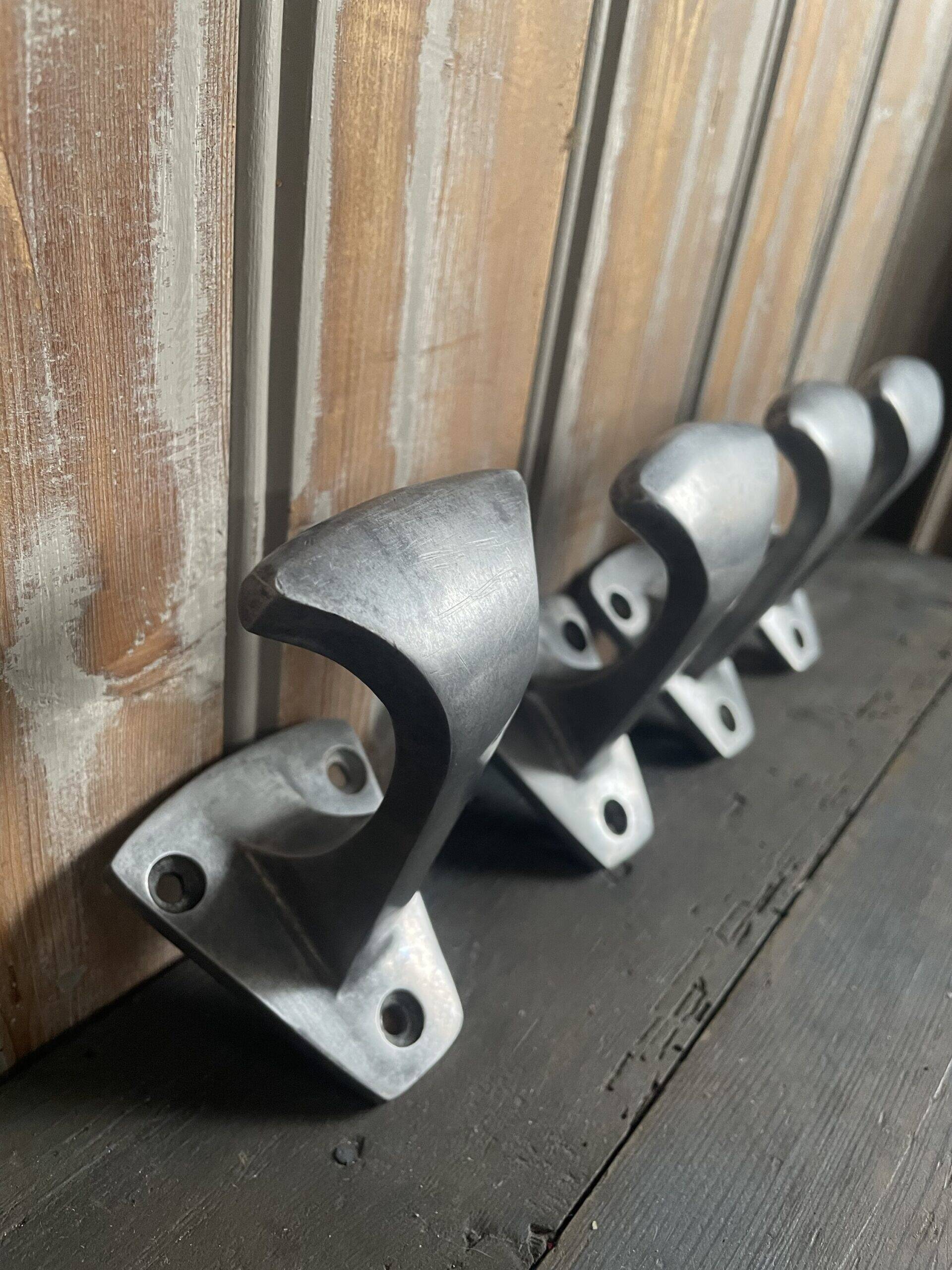 4 metal coat hooks, 1950s