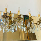 Pair of gilt bronze wall sconces with pendants from the mid-20th century.