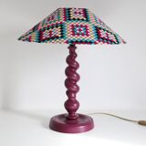 Table lamp in turned wood and printed conical shade