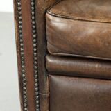 Armchair / lounge chair made of sheepskin leather with characterful patina