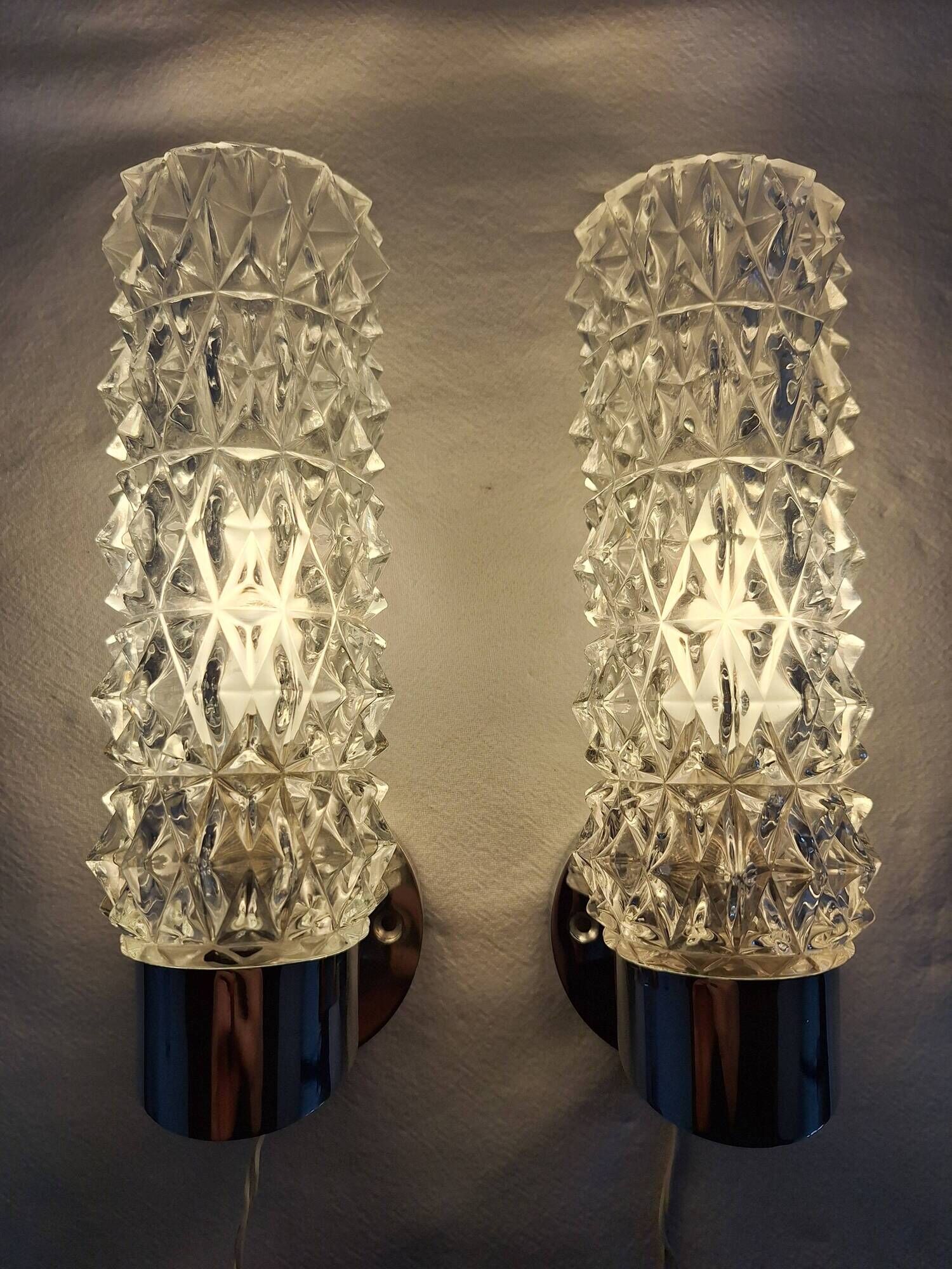 Pair of vintage Art Deco space age chrome and molded glass wall sconces