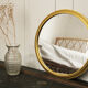 Miroir vintage rond  bordure acier doré
