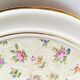Vintage round trivet, ideal for adding a romantic touch.