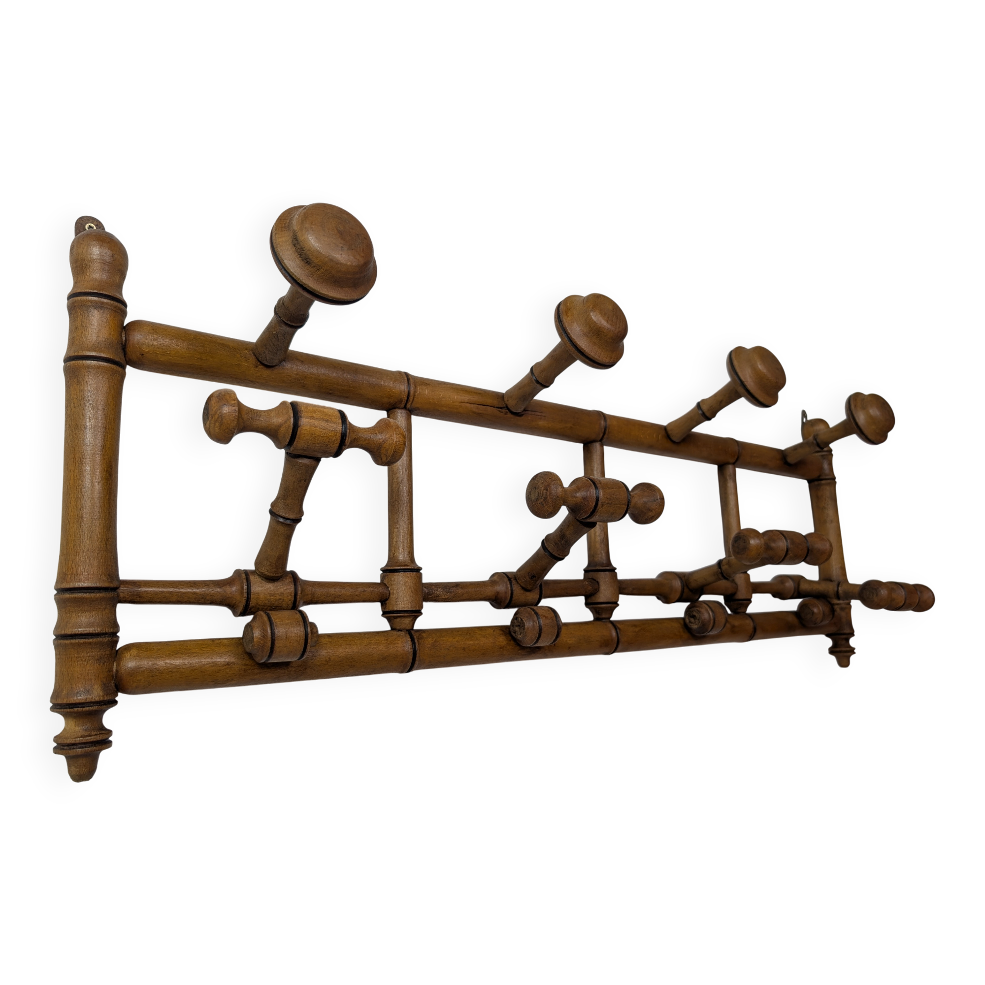 Wall-mounted coat rack made of turned wood