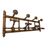 Wall-mounted coat rack made of turned wood