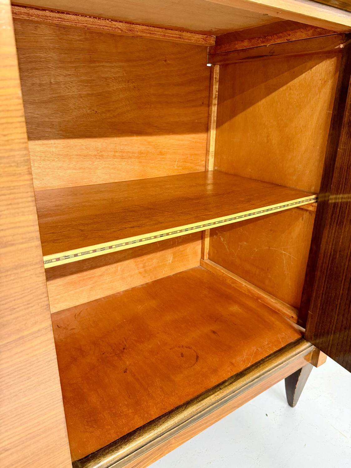 Antique art deco sideboard from the 1930s with veneered wood and bronze insert