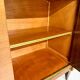 Antique art deco sideboard from the 1930s with veneered wood and bronze insert