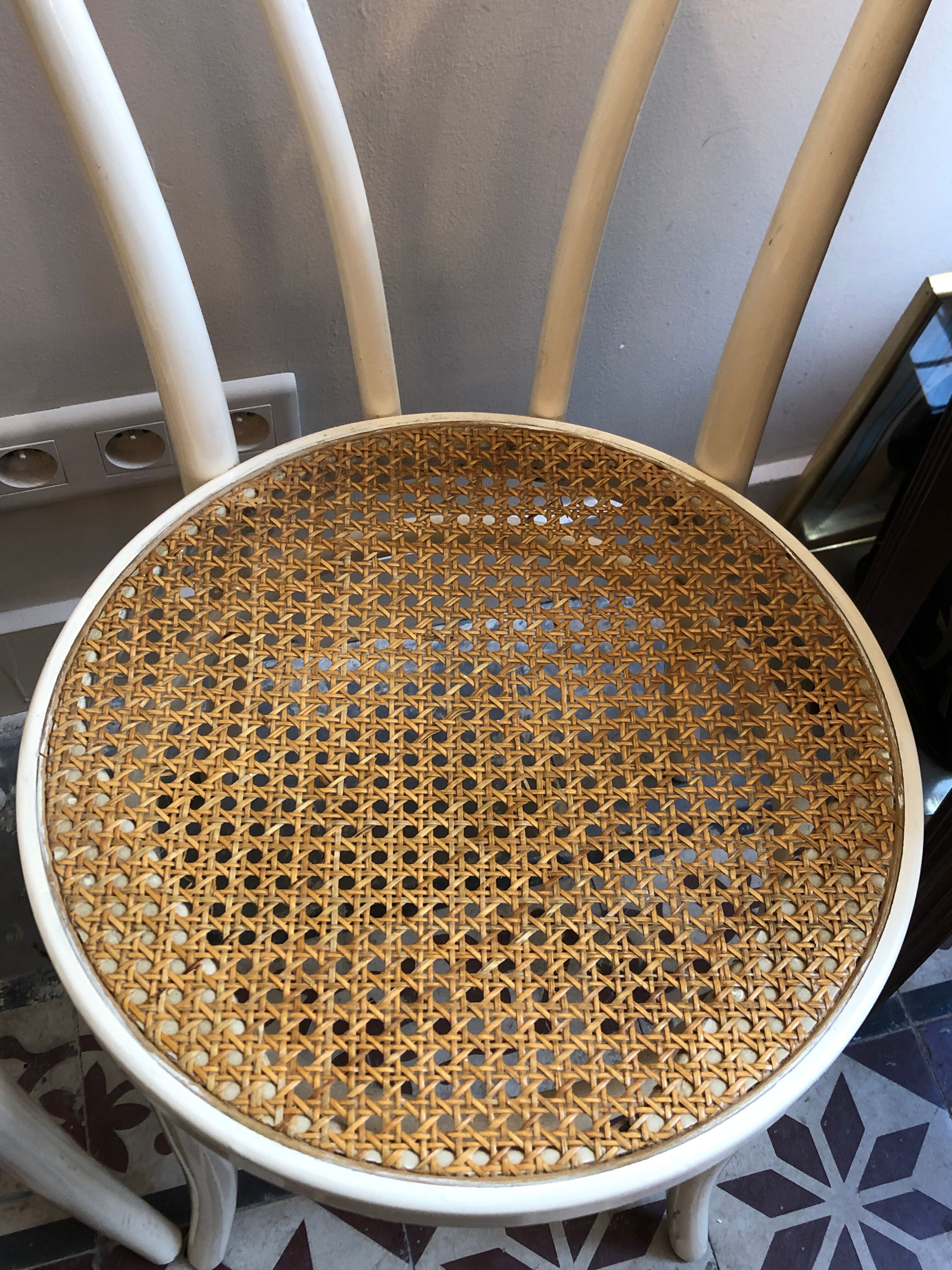 Couple of white bistro chairs