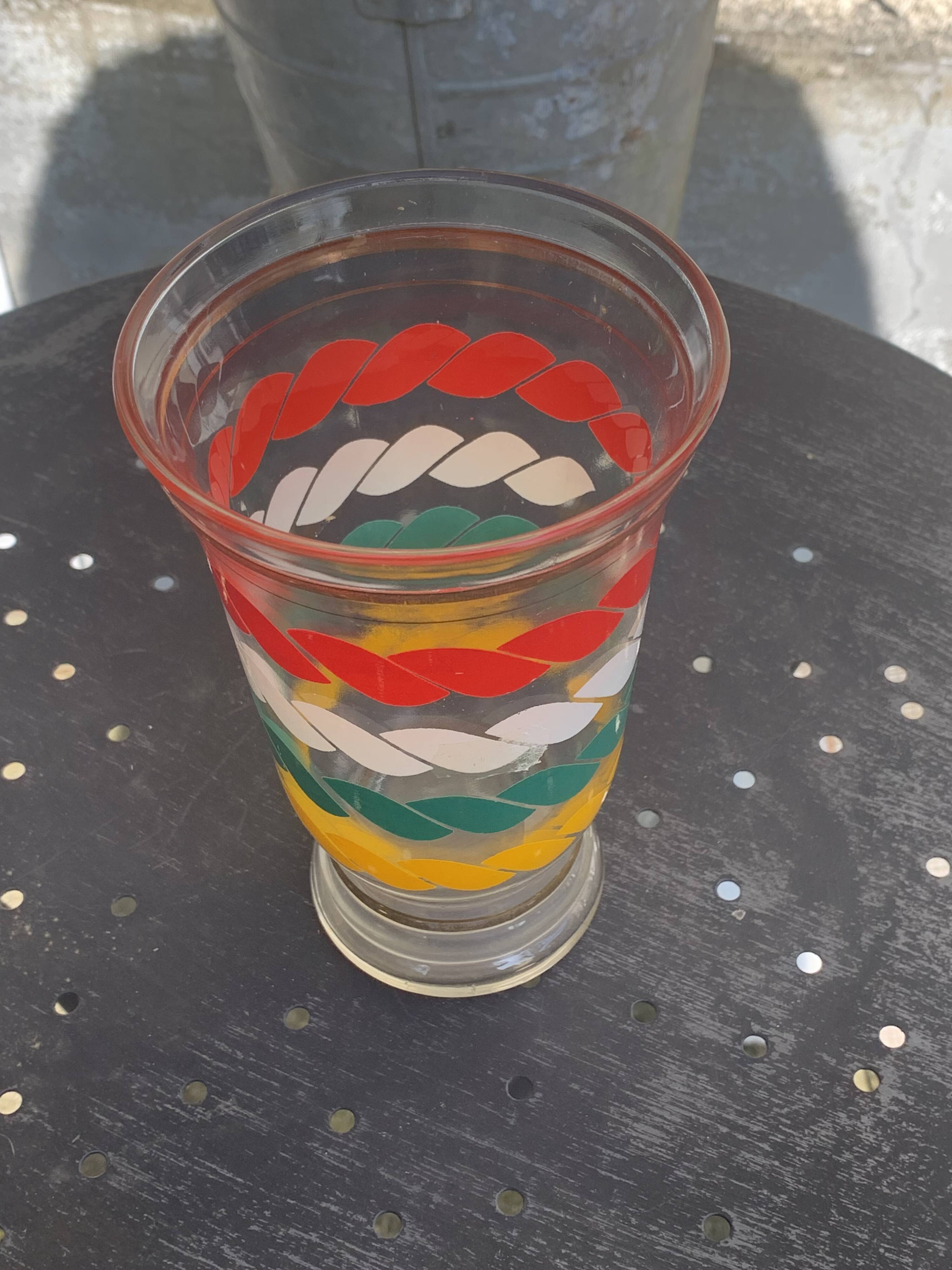 Transparent and gold glass vase and red, white, green and yellow silkscreen lines vintage 1960