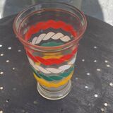 Vase en verre transparent et dore et lignes sérigraphies rouge, blanc, vert et jaune vintage 1960