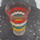 Transparent and gold glass vase and red, white, green and yellow silkscreen lines vintage 1960