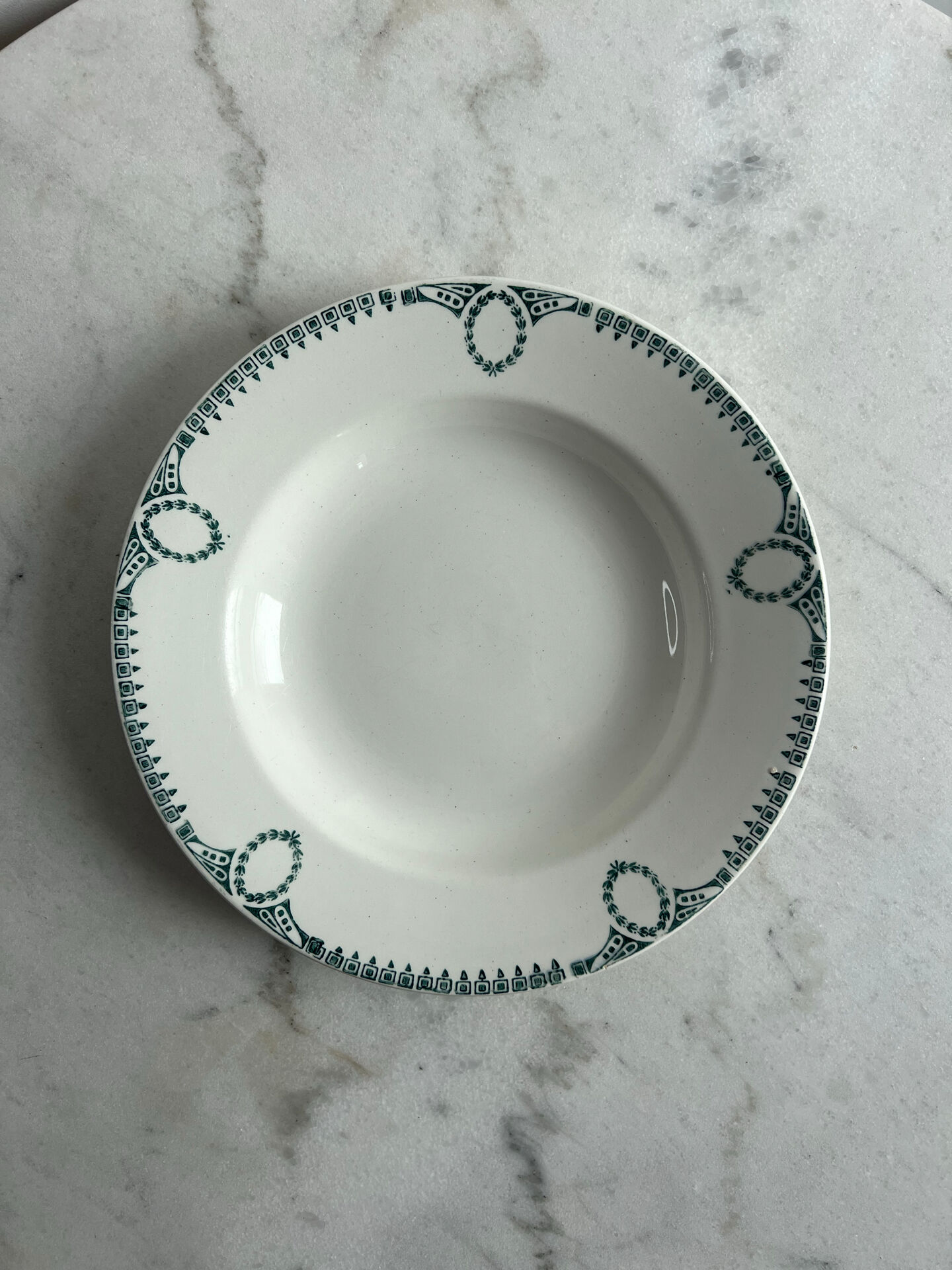Set of 3 St Amand deep plates with green crown decoration.