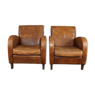 Set of two cowhide leather armchairs