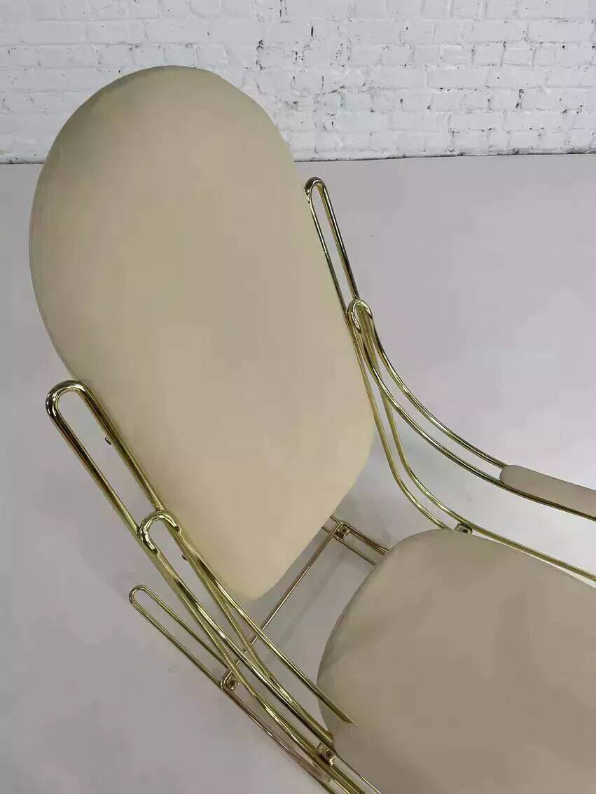 1960s rocking chair in brass and ecru imitation leather