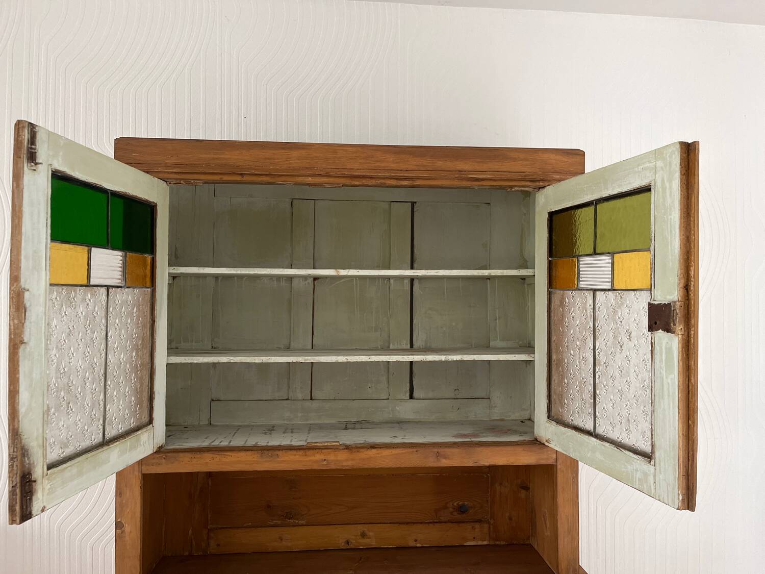 Antique dresser with glass doors and fleur-de-lys from the 50s