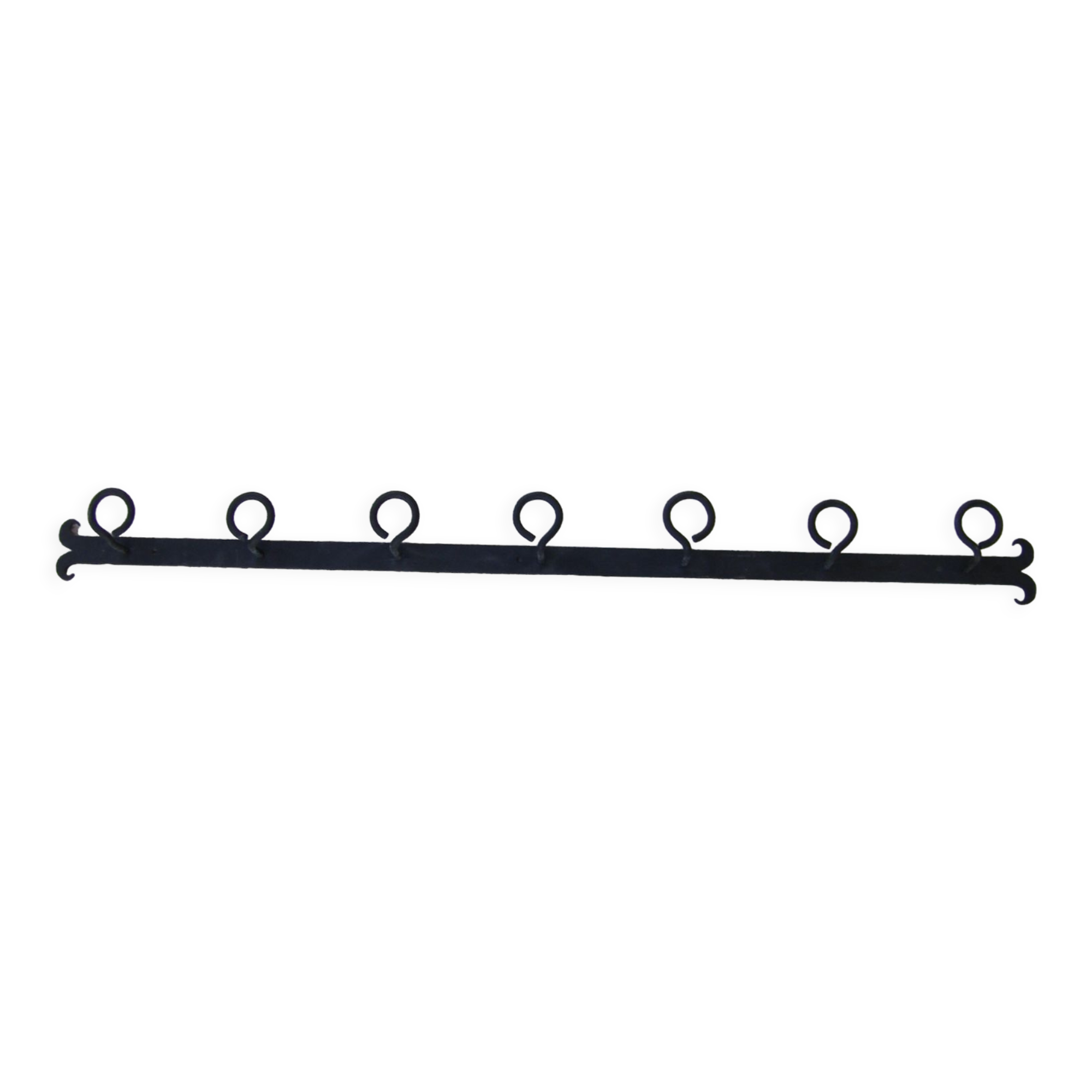 Wall-mounted wrought iron coat racks.
