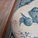 Antique trivet in Gien tile with blue bird decoration – wooden border