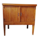 Vintage storage unit with two doors and four drawers.
