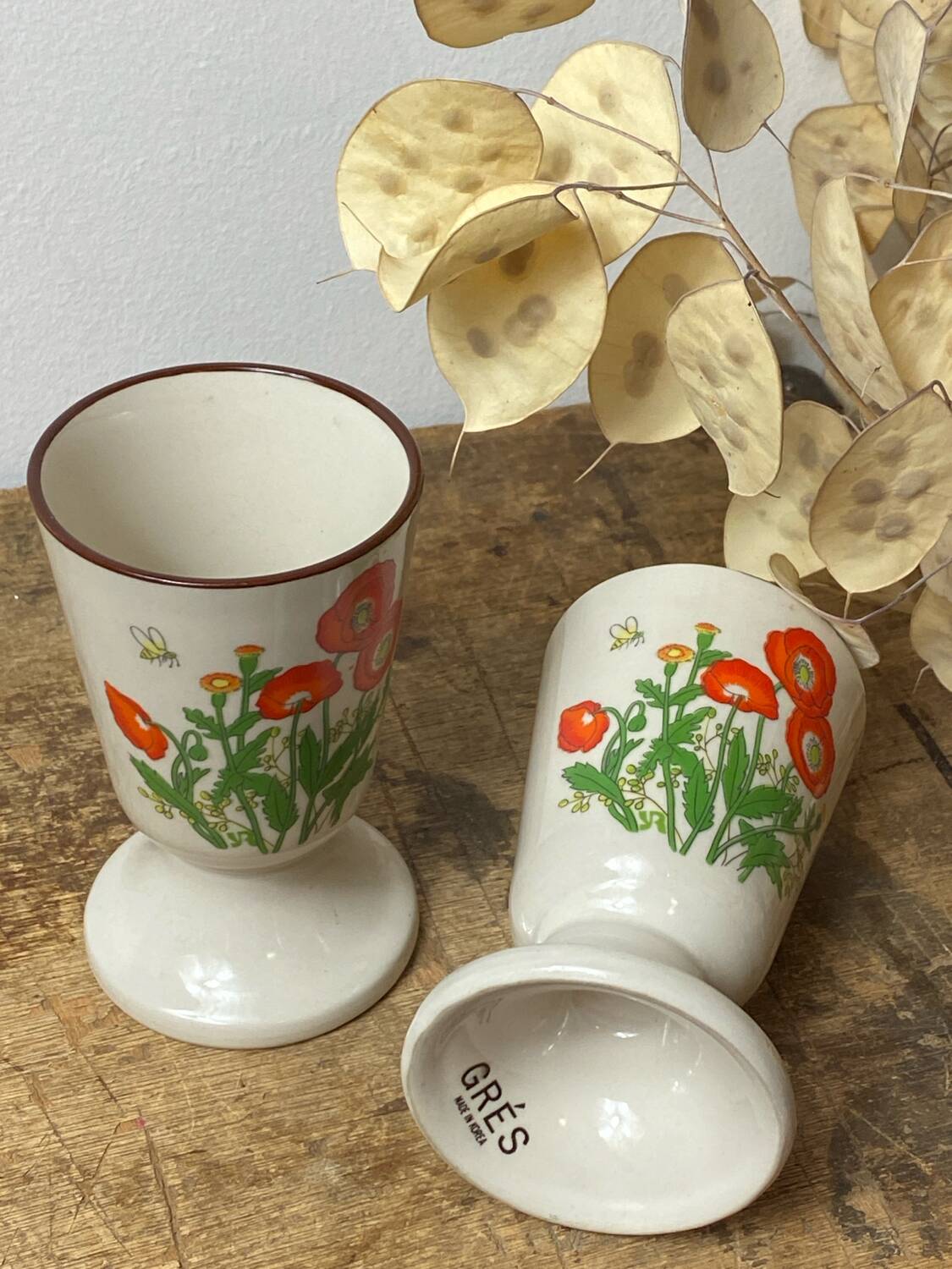 Pair of stoneware mazagrans, poppy decoration