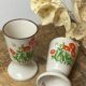 Pair of stoneware mazagrans, poppy decoration