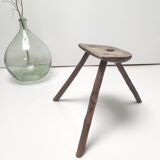 Brutalist tripod stool in solid wood half round