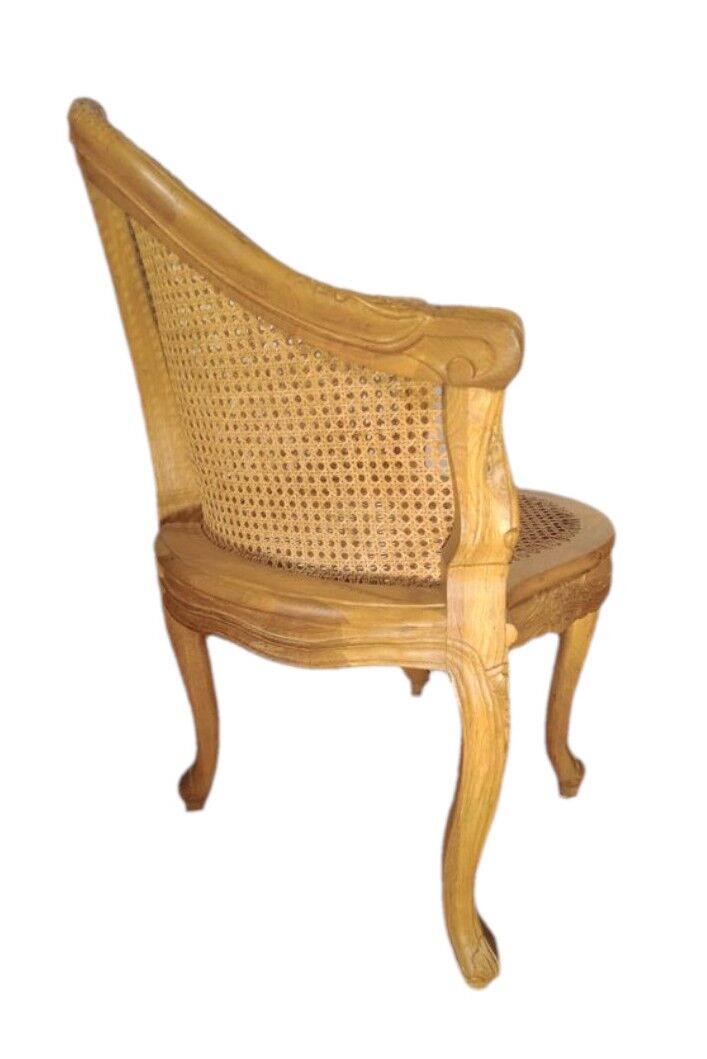 Armchair in solid oak with caning and a central leg (known as couillard), 89x68cm.