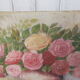 Tableau of a bouquet of flowers on a double-sided wooden panel.