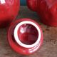Teapot and cup in the shape of a strawberry.