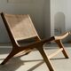 Reclining armchair in natural wood and woven rattan