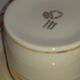6 white cups and their limoges porcelain saucers. Signed Giroud.