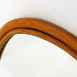 Rounded wall mirror in rattan 35x45cm