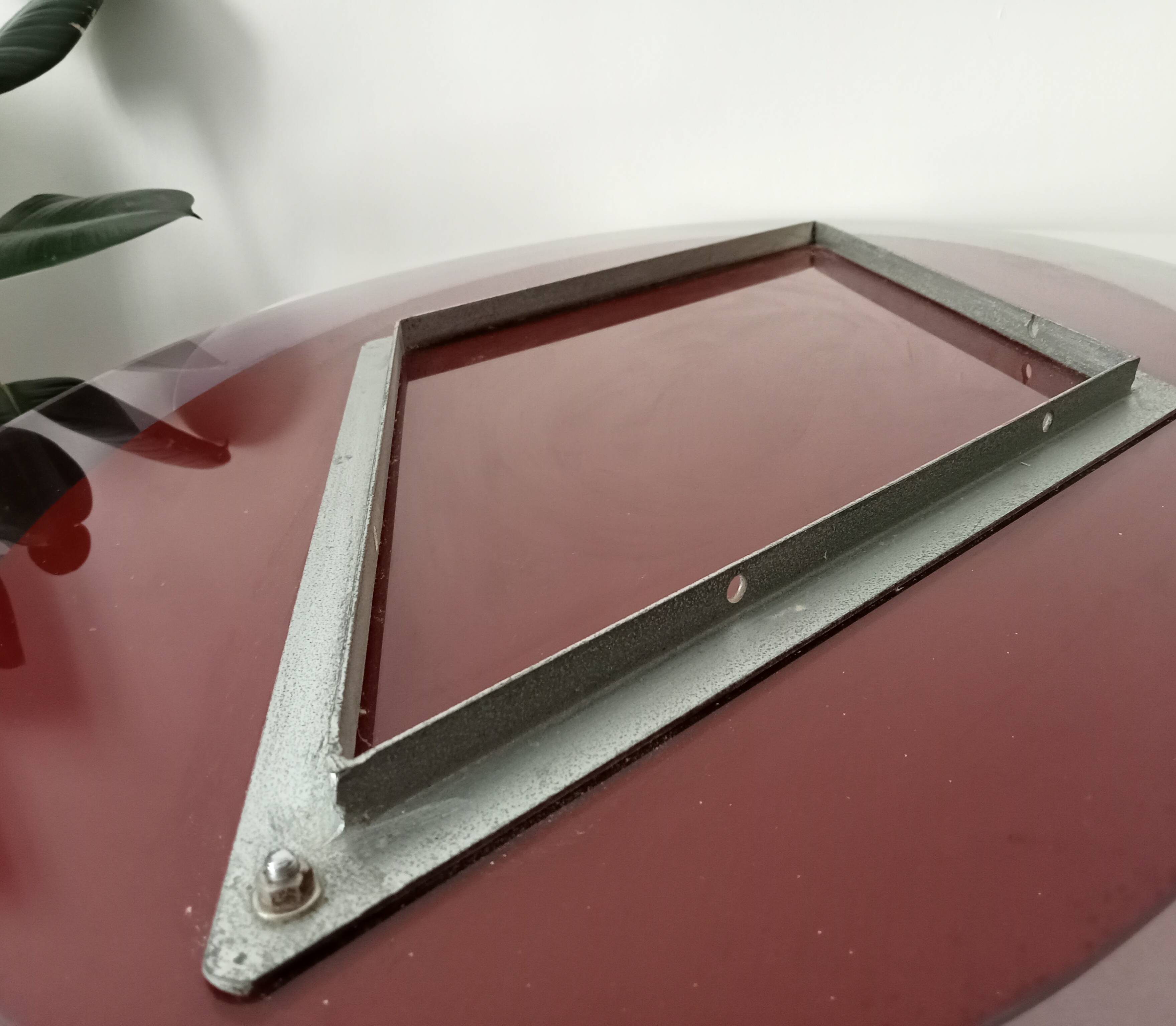 Vintage oval plexiglass mirror from the 70s by Harvey Guzzini