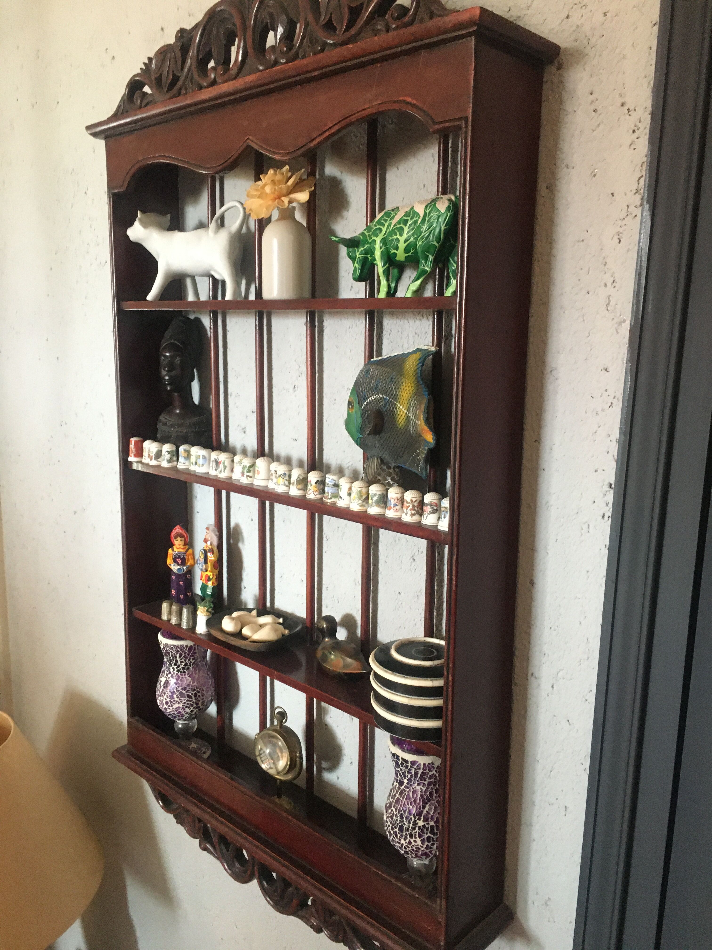 Carved wooden wall shelf for collection or other.