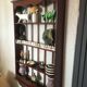 Carved wooden wall shelf for collection or other.