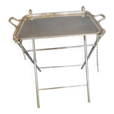 Foldable metal table in silver.
