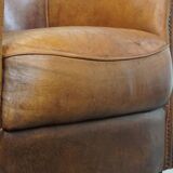 Sheep leather club chair in a cognac color with patina