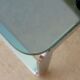 Table basse vintage en métal chromé et en verre fumé
